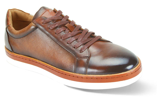 The Giovanni Porter Tan Leather Shoes by GIOVANNI, featuring welted brown laces and white soles, are displayed against a white background.