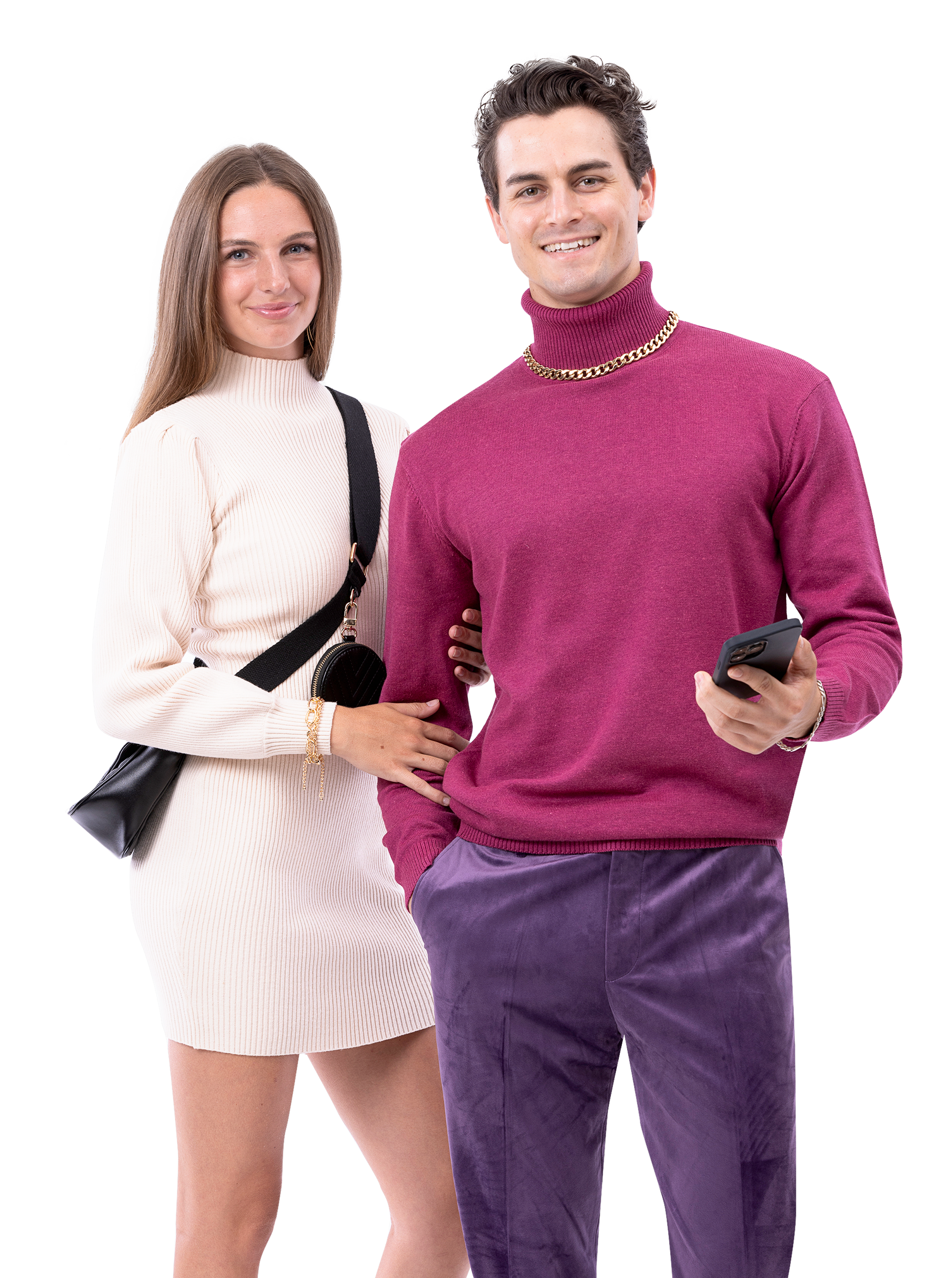 A woman in a cream turtleneck dress stands beside a man wearing a maroon turtleneck and EJ Samuel Lavender Pants PV01 from EJ SAMUEL, holding a phone. Both are smiling and looking at the camera.