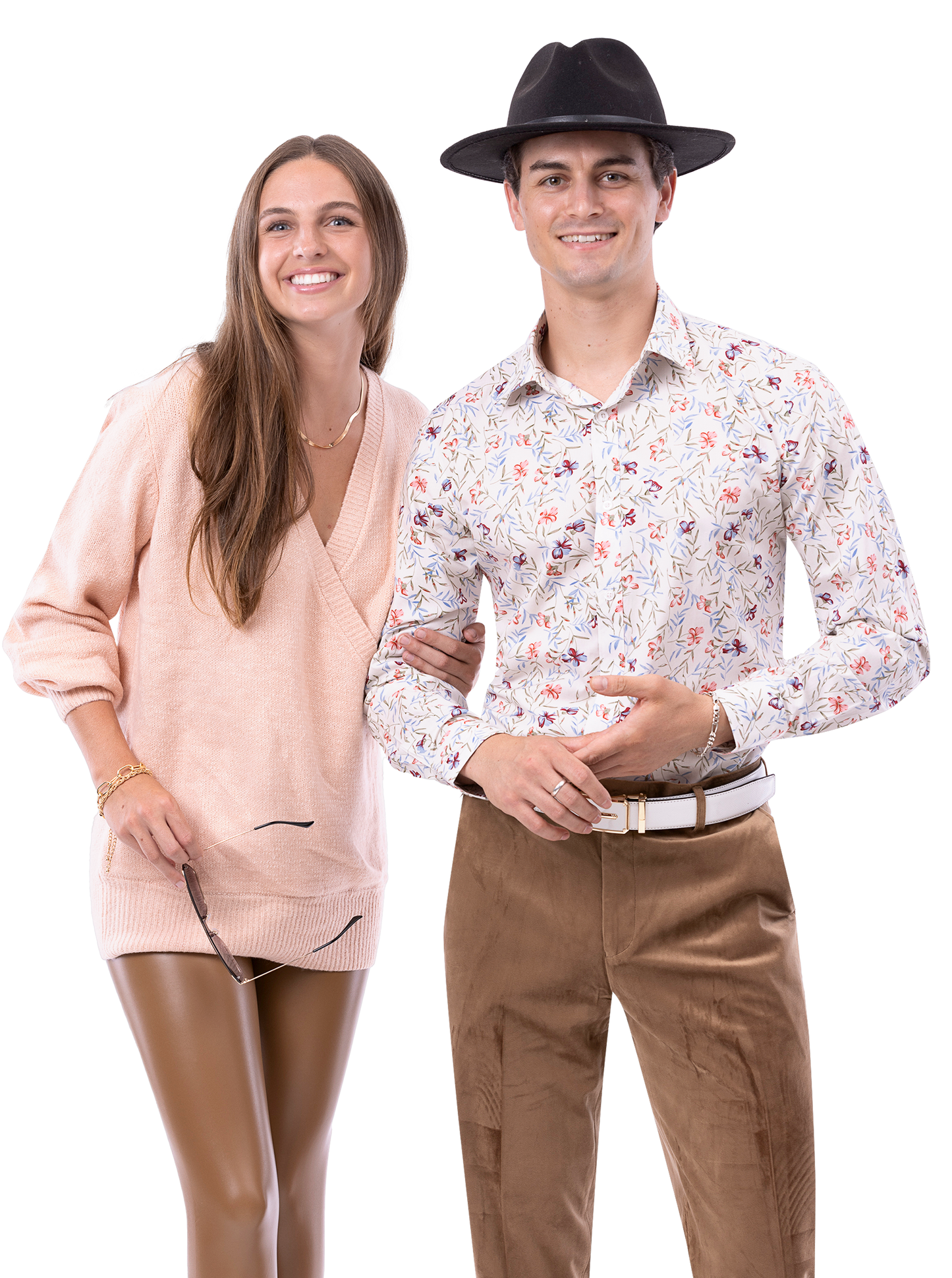 A woman in a peach sweater and a man wearing a hat, floral shirt, and EJ Samuel Taupe Pants PV01 stand smiling side by side.