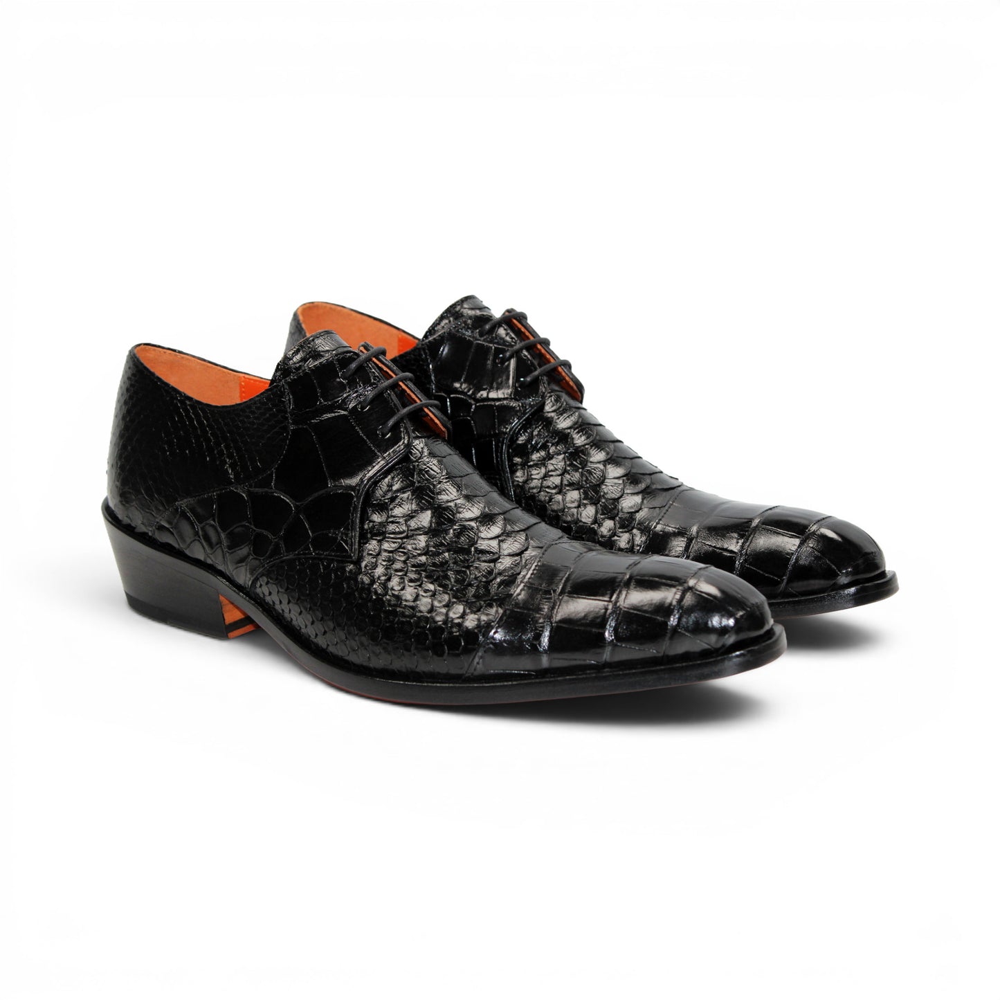 Introducing the Fennix Roger Black by Fennix of Italy—a luxury, pointed-toe dress shoe crafted in Italy from genuine alligator leather. Featuring a textured snake-skin pattern and low heel, this premium shoe is shown in profile against a white background as part of our exclusive collection.