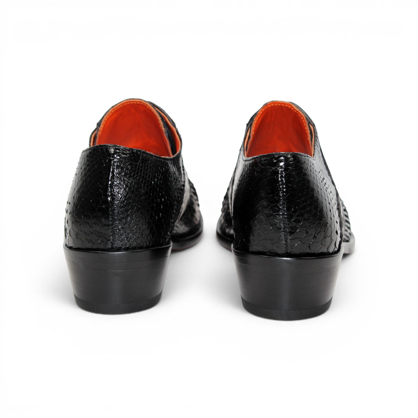 Introducing the Fennix Roger Black by Fennix of Italy—a luxury, pointed-toe dress shoe crafted in Italy from genuine alligator leather. Featuring a textured snake-skin pattern and low heel, this premium shoe is shown in profile against a white background as part of our exclusive collection.