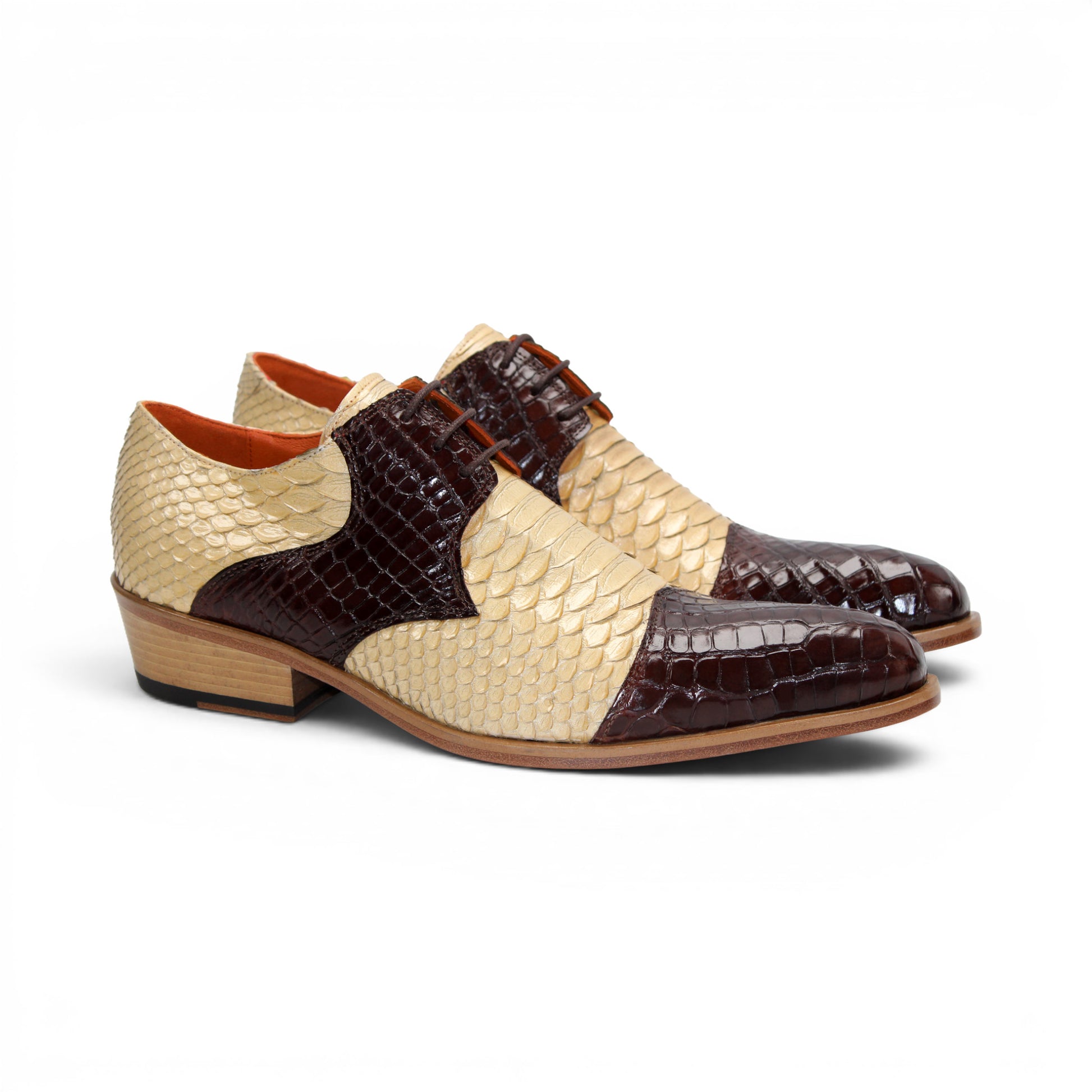 Showcased in profile on a white background, the Fennix Roger Brown/Beige by Fennix of Italy is a luxurious men's dress shoe, crafted in Italy from genuine alligator leather with beige and dark brown scales, a low wooden heel, and lace-up closure.