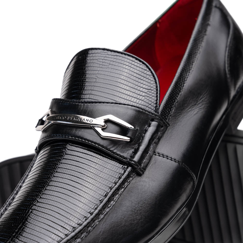 The Ravello Black by Marco Di Milano is a pair of black leather loafers with metal accents, textured uppers, a red interior lining, and ribbed rubber soles—making an exquisite statement in luxury footwear.