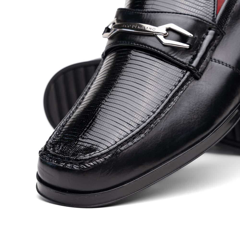 The Ravello Black by Marco Di Milano is a pair of black leather loafers with metal accents, textured uppers, a red interior lining, and ribbed rubber soles—making an exquisite statement in luxury footwear.