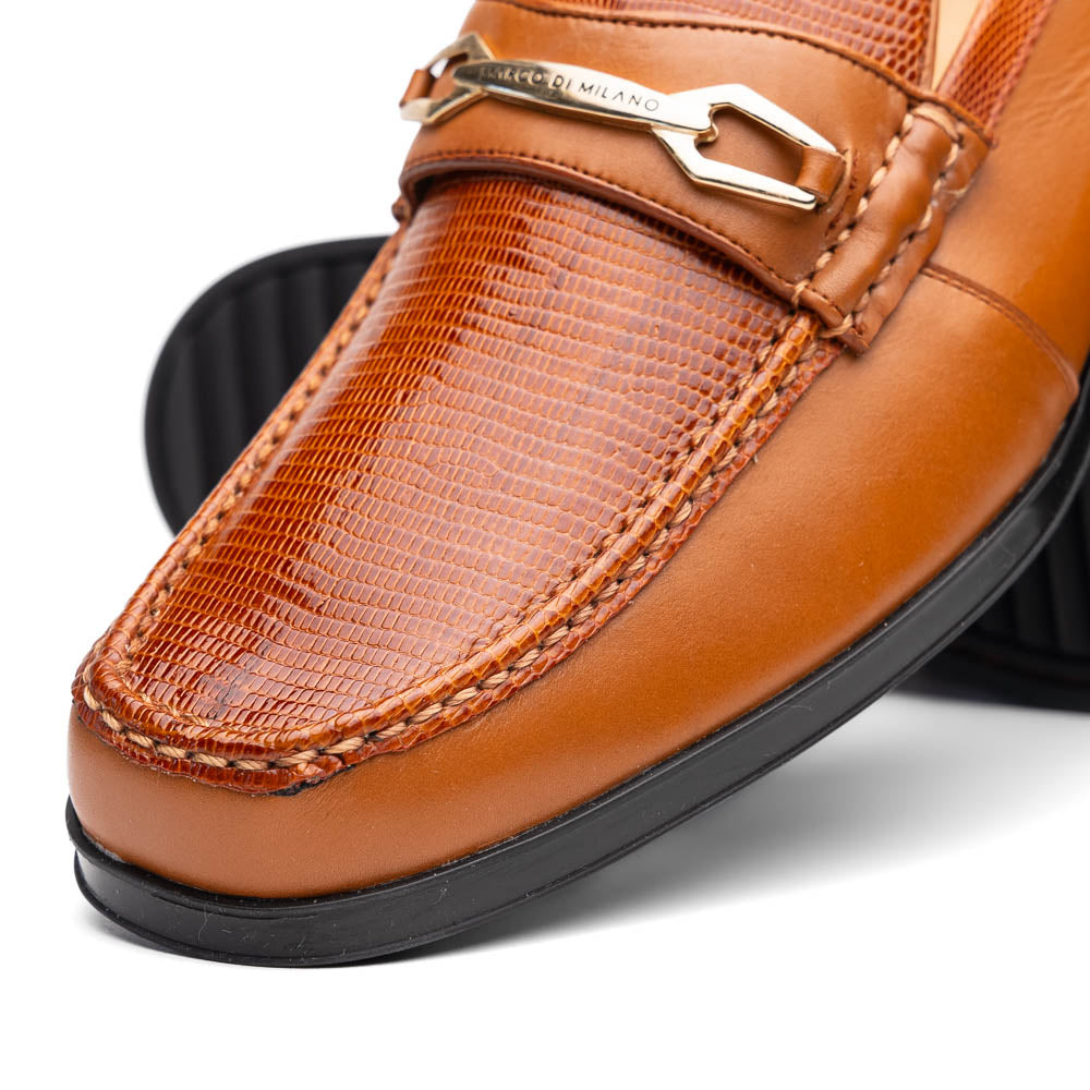 The Marco Di Milano Ravello Honey is a brown leather loafer with a textured finish and metal detail, displayed upright and on its side to show the rubber sole—ideal for those seeking luxury footwear.