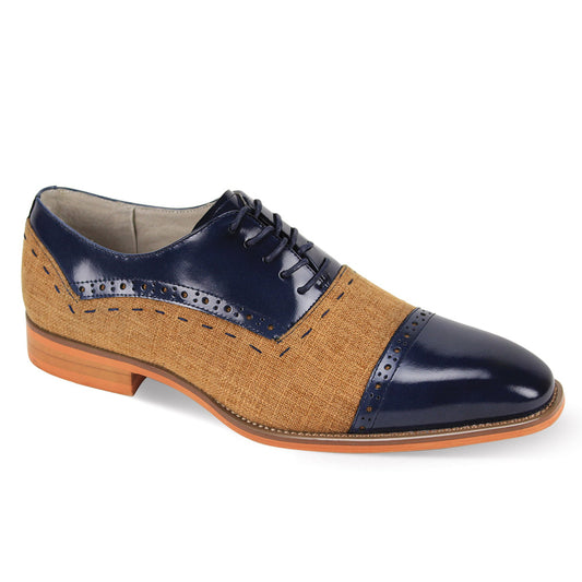 The Giovanni Reed Navy/Tan Leather Shoes by GIOVANNI feature a tan fabric body with a navy blue leather cap toe and heel, adorned with decorative perforations and sleek laces.