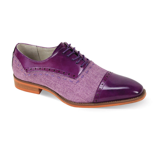 The Giovanni Reed Purple/Lavender Leather Shoes by GIOVANNI are men's dress shoes with a lace-up design, textured fabric body, and glossy leather accents. They feature a cap toe and have a brown sole and heel.