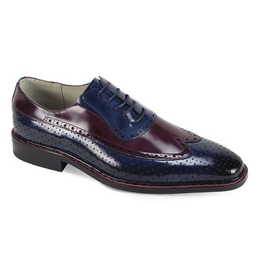 The Giovanni Rio Blue/Burgundy Leather Shoes by GIOVANNI are polished leather wingtip brogues in dark blue and burgundy, with contrasting stitches, perforated detailing, and elegantly finished with natural laces.