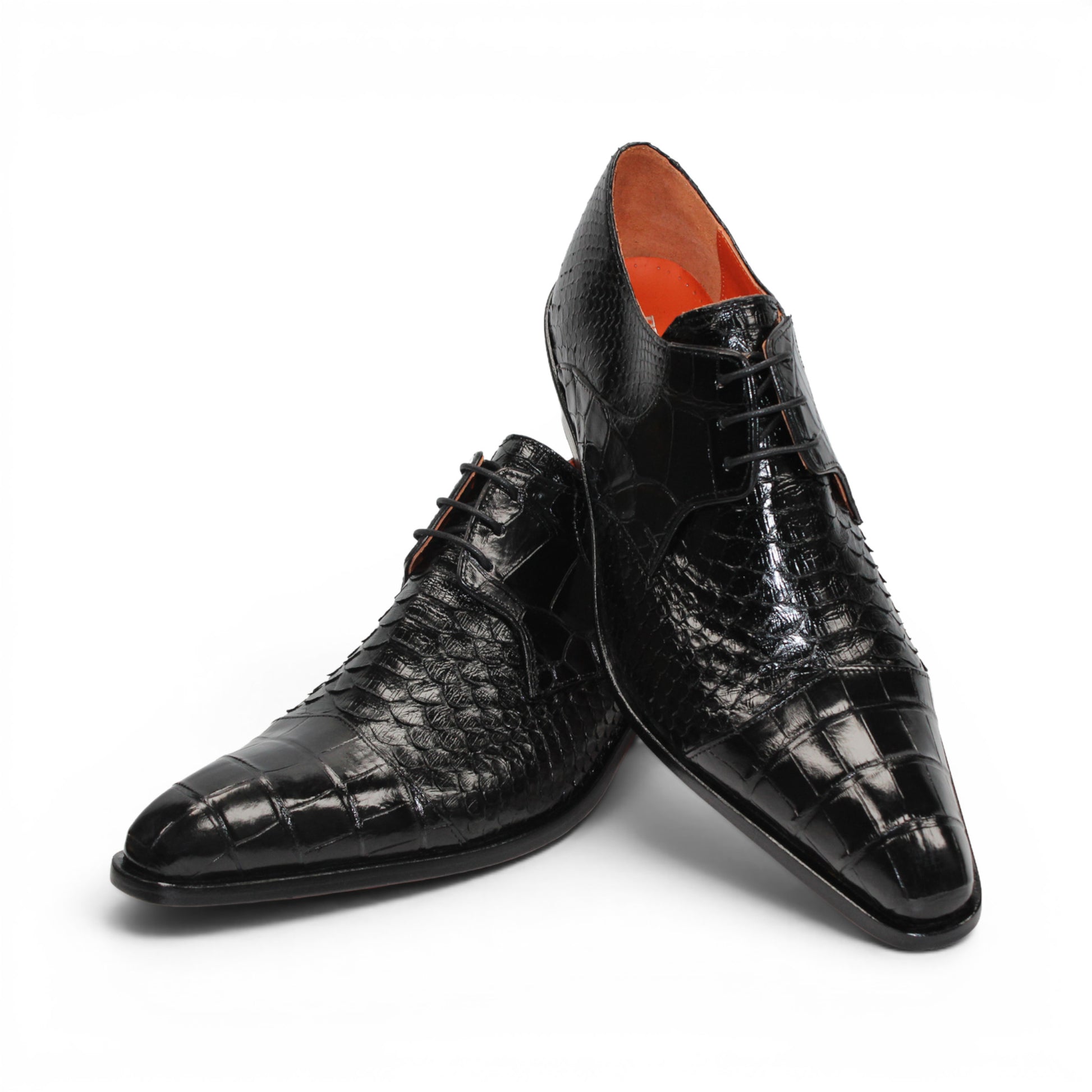 Introducing the Fennix Roger Black by Fennix of Italy—a luxury, pointed-toe dress shoe crafted in Italy from genuine alligator leather. Featuring a textured snake-skin pattern and low heel, this premium shoe is shown in profile against a white background as part of our exclusive collection.