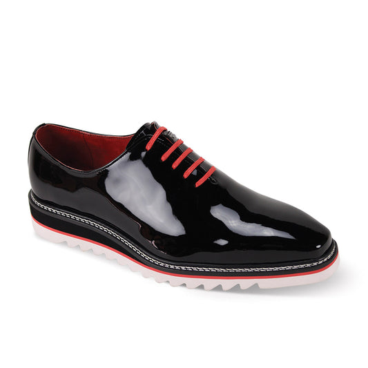 Introducing the Giovanni Ruben Black Patent Leather Shoes by GIOVANNI, a sleek black plain toe dress shoe adorned with eye-catching red laces and complemented by a white treaded sole.