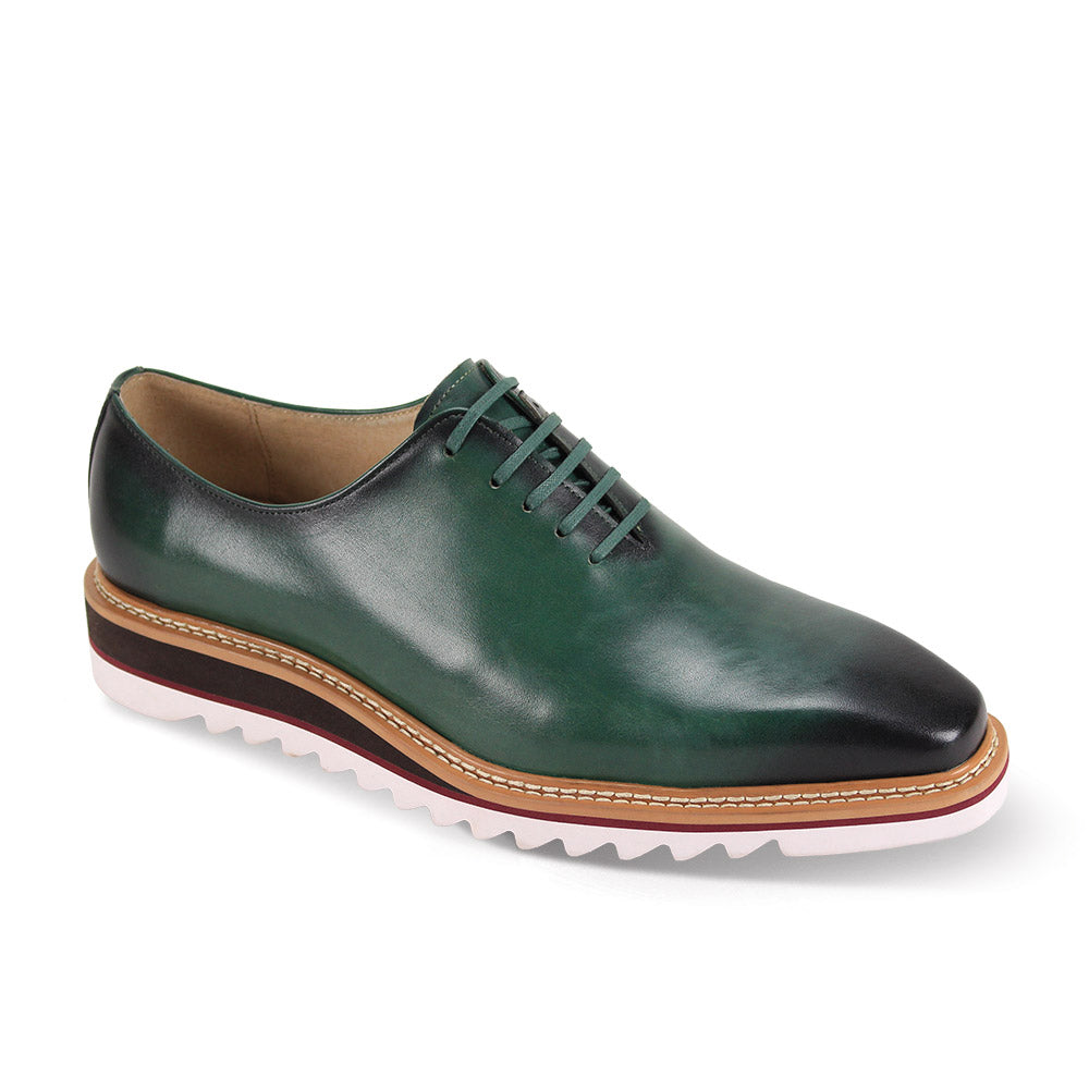 Giovanni Ruben Forest Green Leather Shoes by GIOVANNI feature a wingtip design, a white and brown layered sole, and lace-up closure.