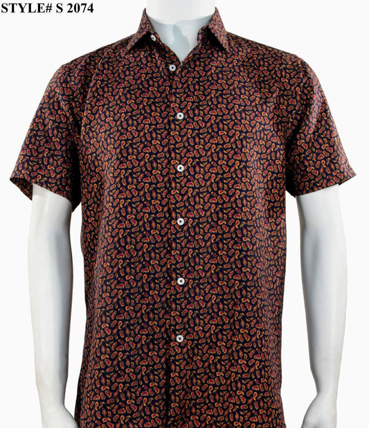 A mannequin models the Sangi Short Sleeve Shirt S 2074, featuring a modern fit and button-up style with a red and orange paisley pattern on a dark background. The corner displays "STYLE# S 2074" from brand Sangi.
