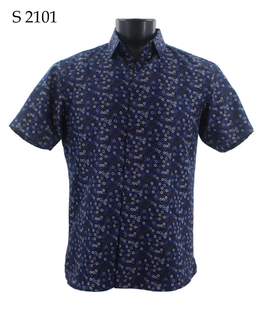 Displayed on a black mannequin, the Sangi Short Sleeve Shirt S 2101 by Sangi features a modern fit and a stylish small white and light blue circular pattern on its blue fabric. It’s an ideal choice for individuals who value timeless fashion in their wardrobe.