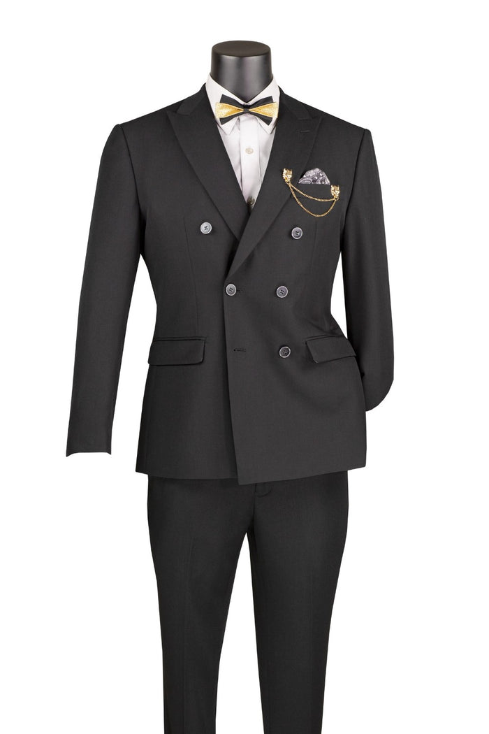 A Vinci Suits Slim Fit Black Double Breasted 2 Piece Suit with Adjustable Waistband SDB-1 worn with a white shirt, gold bowtie, patterned pocket square, and a gold lapel chain on a mannequin.