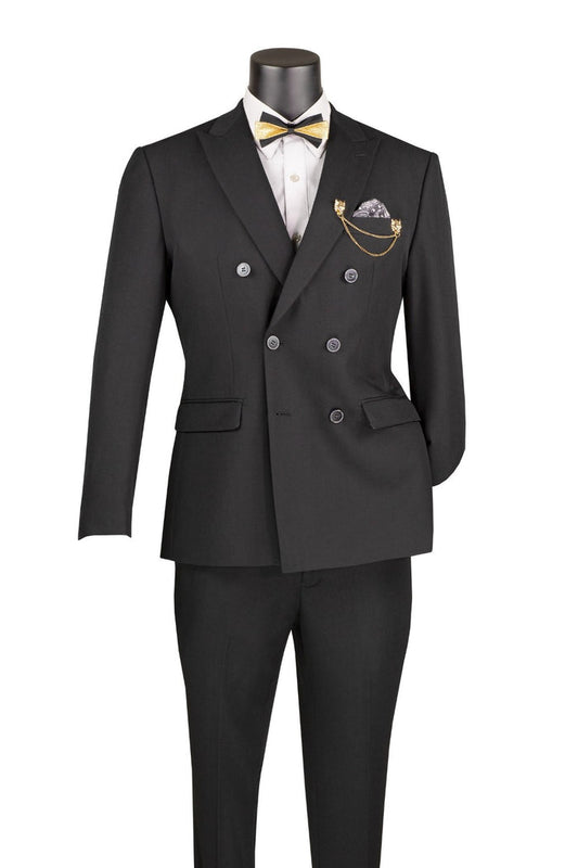A Vinci Suits Slim Fit Black Double Breasted 2 Piece Suit with Adjustable Waistband SDB-1 worn with a white shirt, gold bowtie, patterned pocket square, and a gold lapel chain on a mannequin.