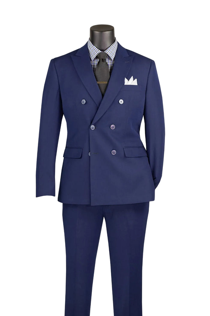 A Vinci Suits Slim Fit Navy Double Breasted 2 Piece Suit with Adjustable Waistband SDB-1 worn with a black-and-white checkered shirt, dark tie, and white pocket square.