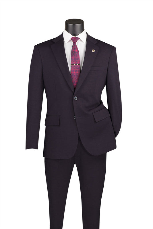 A black mannequin showcases the Vinci Suits Slim Fit 2 Piece Suit in charcoal stretch fabric with an adjustable waistband, paired with a crisp white shirt and vibrant red tie.