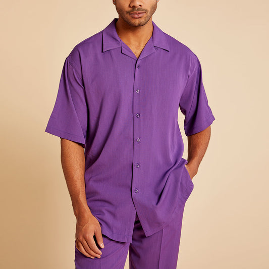 A person wears the Inserch Crepe Camp Collar Shirt SE9356-00087 in Plum by Inserch with matching pants, standing against a beige background.