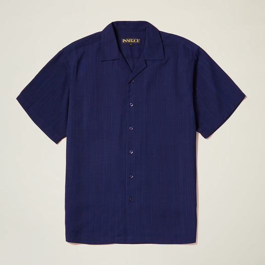The Inserch Crepe Camp Collar Shirt SE9356-00011 in solid navy blue poly-crepe fabric by Inserch is shown with short sleeves, laid flat on a light background.