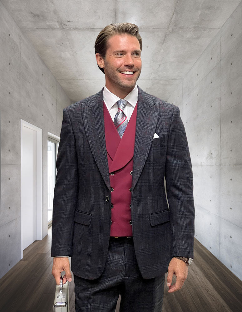 A man in a STATEMENT CLOTHING | SORENTO-BLACK modern fit plaid suit by Statement Clothing stands in a sleek concrete hallway, smiling and holding a briefcase.