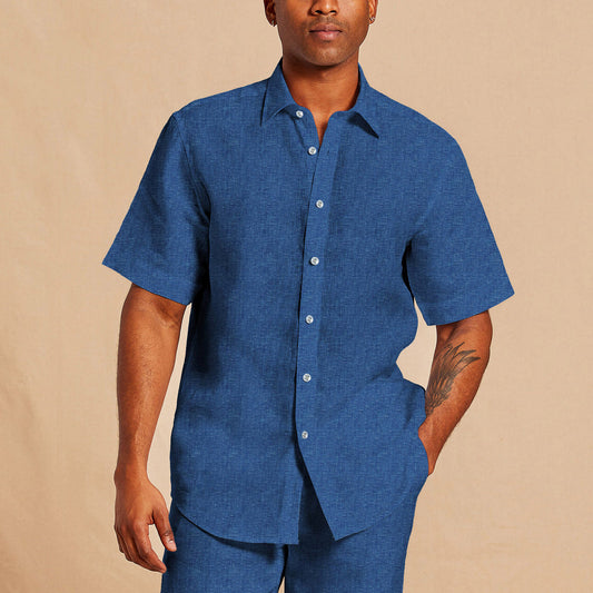 A person wearing the Inserch SS Linen Shirt SS717-00181 in River Blue with matching pants, standing against a beige background.
