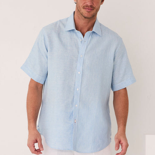 A man stands against a white background, wearing the Inserch Linen 2pc Set (SS717) in Blue Mist: a light blue short-sleeve shirt and matching pants by Inserch.