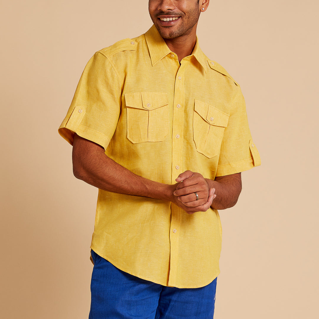 A man wears the Inserch Linen 2pc Set (SS718) Banana Cream—short-sleeve yellow button-up shirt with chest pockets and matching blue pants by Inserch, crafted from premium European flax linen for timeless comfort and elegance.