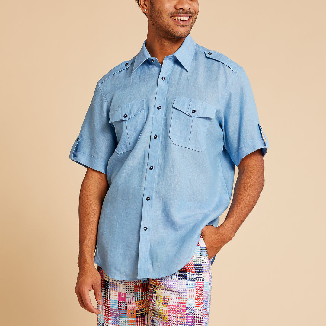 A person wearing the Inserch Linen 2pc Set (Shirts and Pants) (SS718) in Lake Blue by Inserch, standing against a beige background.