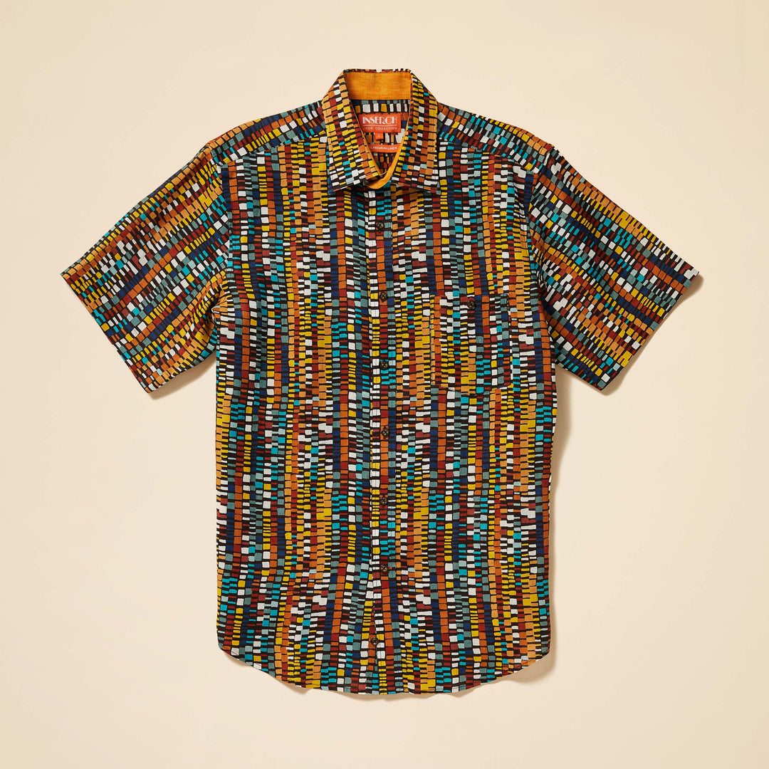 The Inserch SS Geo Print Linen Shirt (SS7918-00167 Cacao) is a short-sleeve, collared shirt made from premium European flax, showcasing a multicolored geometric print in yellow, brown, blue, and white on beige.