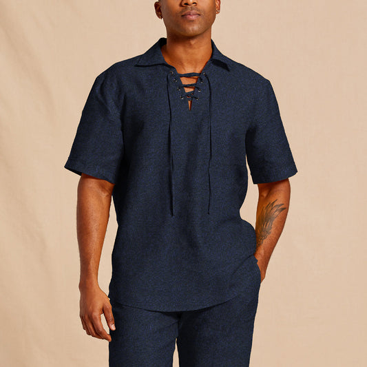 A person wears the Inserch SS Linen Lace Front Pullover Shirt SS811-00036 Ink by Inserch with matching pants, standing against a beige background.