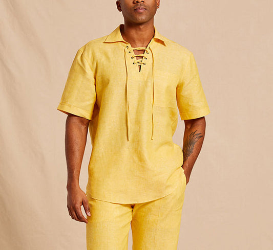 A person wears the Inserch SS Linen Lace Front PO Shirt SS811-00145 in Banana Cream, a short-sleeve linen pullover with a lace-up neckline by Inserch, paired with matching yellow pants against a beige background.