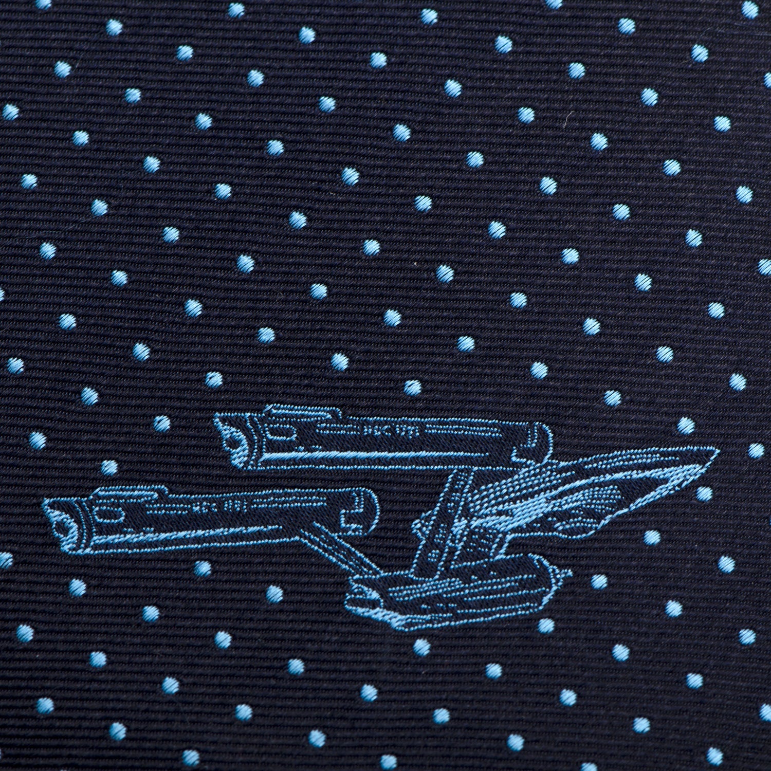 The Star Trek Enterprise Dot Blue Men's Tie by Cufflinks.com features a navy silk design with light blue polka dots and the USS Enterprise, perfect for fans.