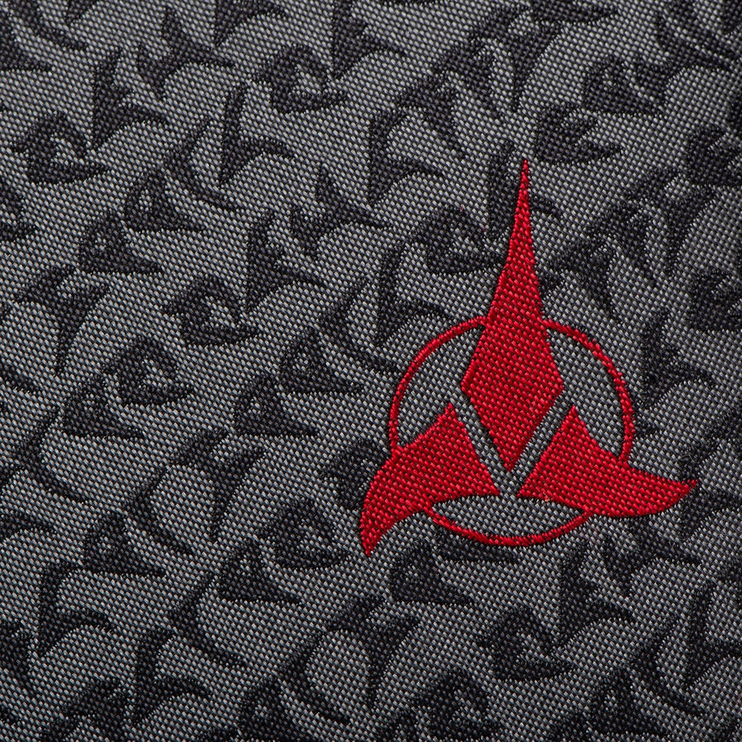 The Cufflinks.com Star Trek Klingon Gray Men's Tie showcases a repeating black symbol pattern and a bold red Klingon emblem at the tip—perfect for any Star Trek collection.
