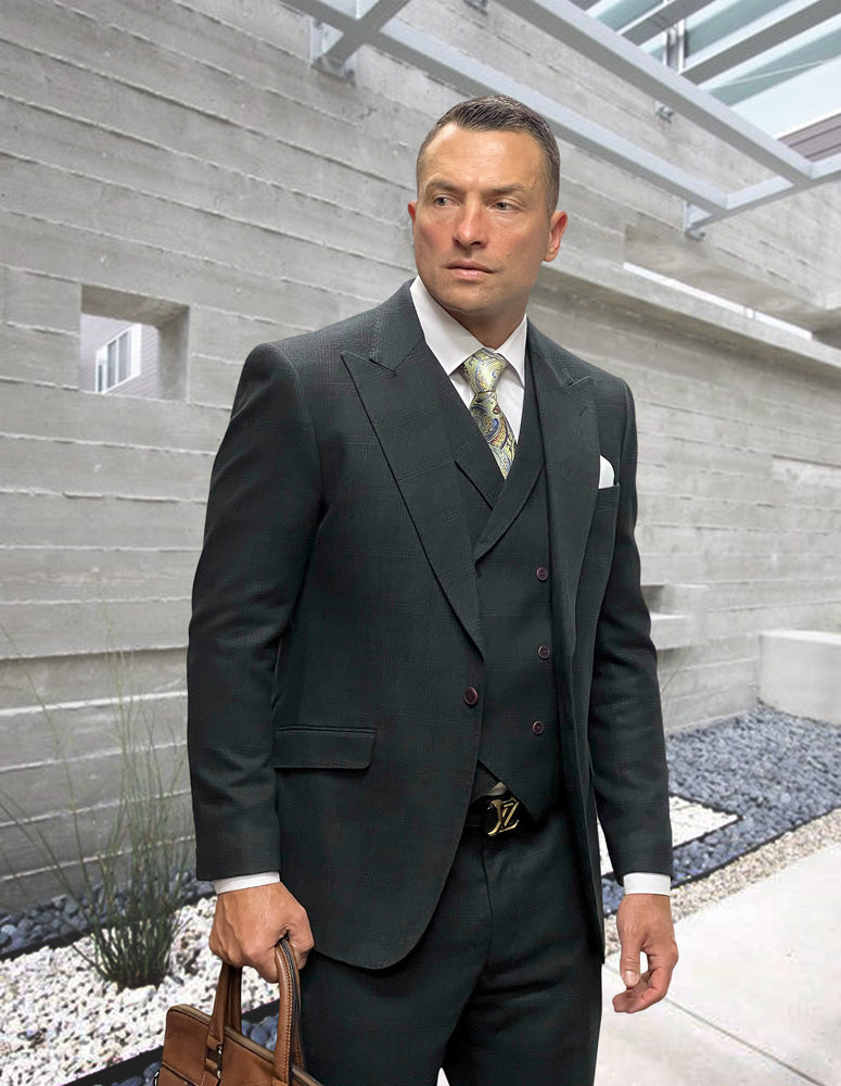 A man in the STATEMENT CLOTHING | STEFANO-HUNTER suit by Statement Clothing holds a brown leather briefcase, standing amid sleek modern concrete architecture.