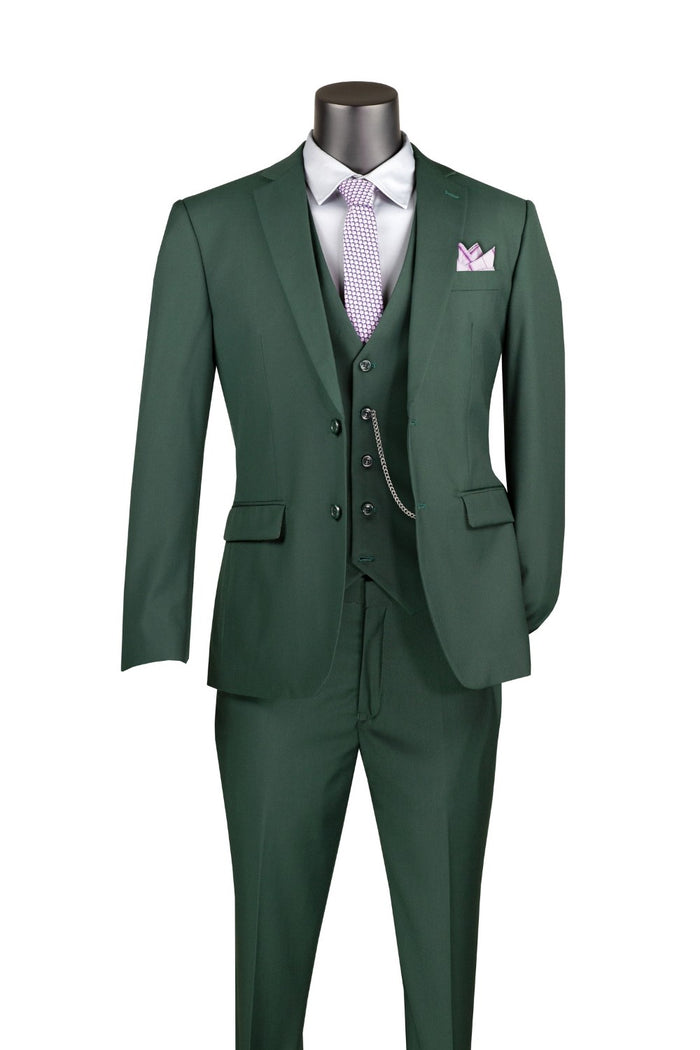 The Slim Fit 3 Piece 2 Button Suit in Hunter Green by Vinci Suits (SV2900) includes a white dress shirt, light purple tie, pocket square, and a vest with a chain accessory for an elegant alternative to a classic tuxedo.
