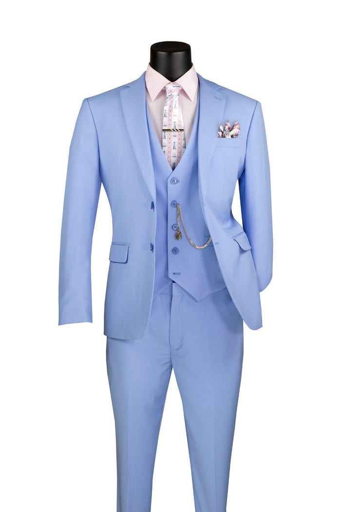 The Vinci Suits Slim Fit 3 Piece 2 Button Suit in light blue (SV2900) features a pastel blue design with a pink shirt, patterned tie, vest, and pocket watch chain. The pocket square complements the tie perfectly.