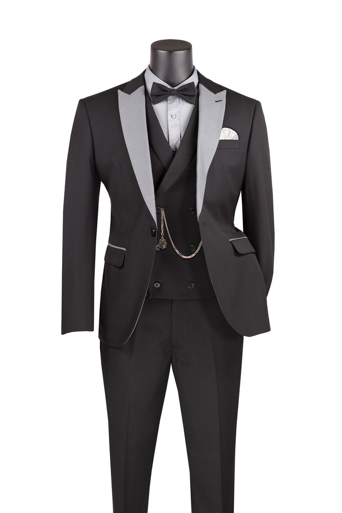 The Vinci Suits Slim Fit 3 Piece Tuxedo Black SV2K-5 features silver peak lapels, a white dress shirt, black bow tie, and pocket square. It includes a vest with a chain accessory for an elegant ensemble.