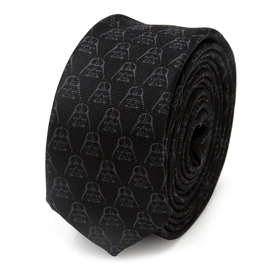 The Star Wars Darth Vader Black Skinny Tie by Cufflinks.com features a subtle pattern of Darth Vader helmets—an elegant silk accessory perfect for any Star Wars fan.
