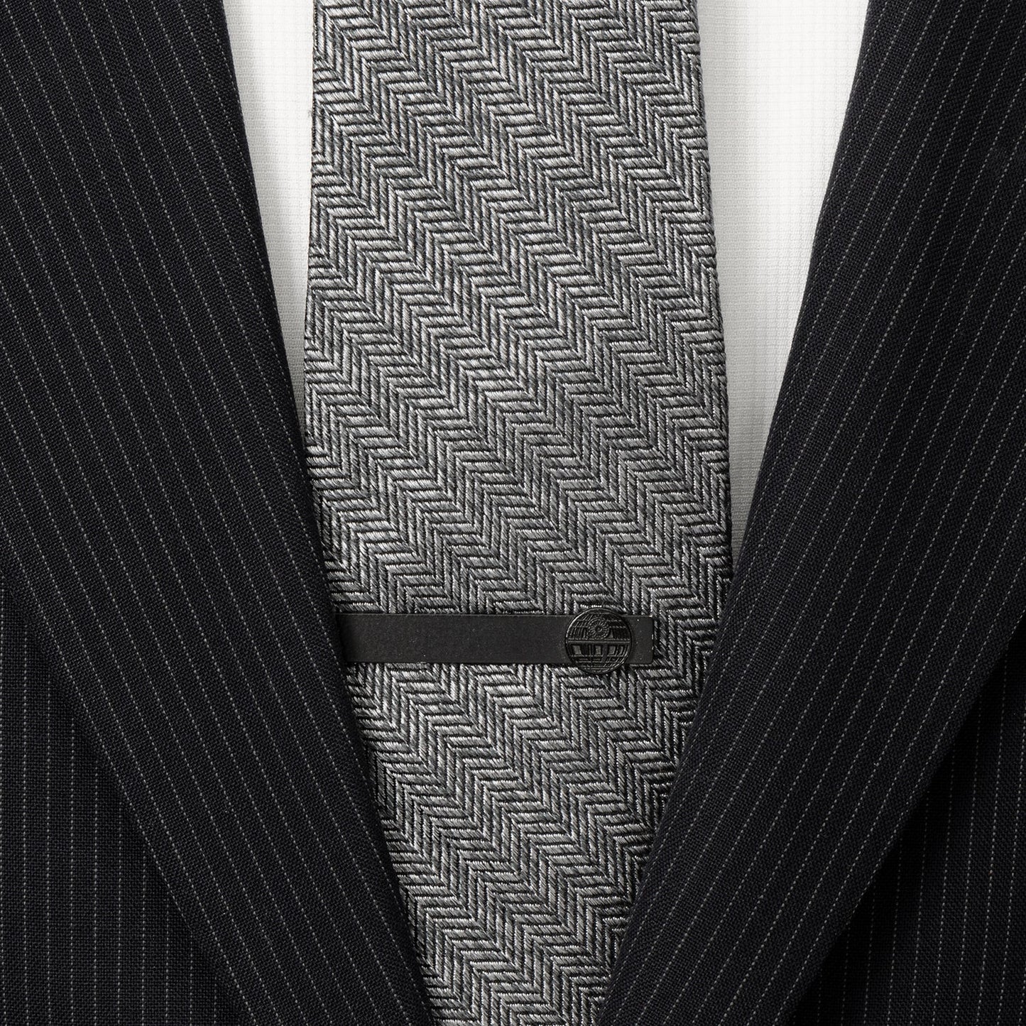 The Star Wars Death Star Satin Black Tie Bar by Cufflinks.com features a circular Death Star design on one end and is shown against a white background.