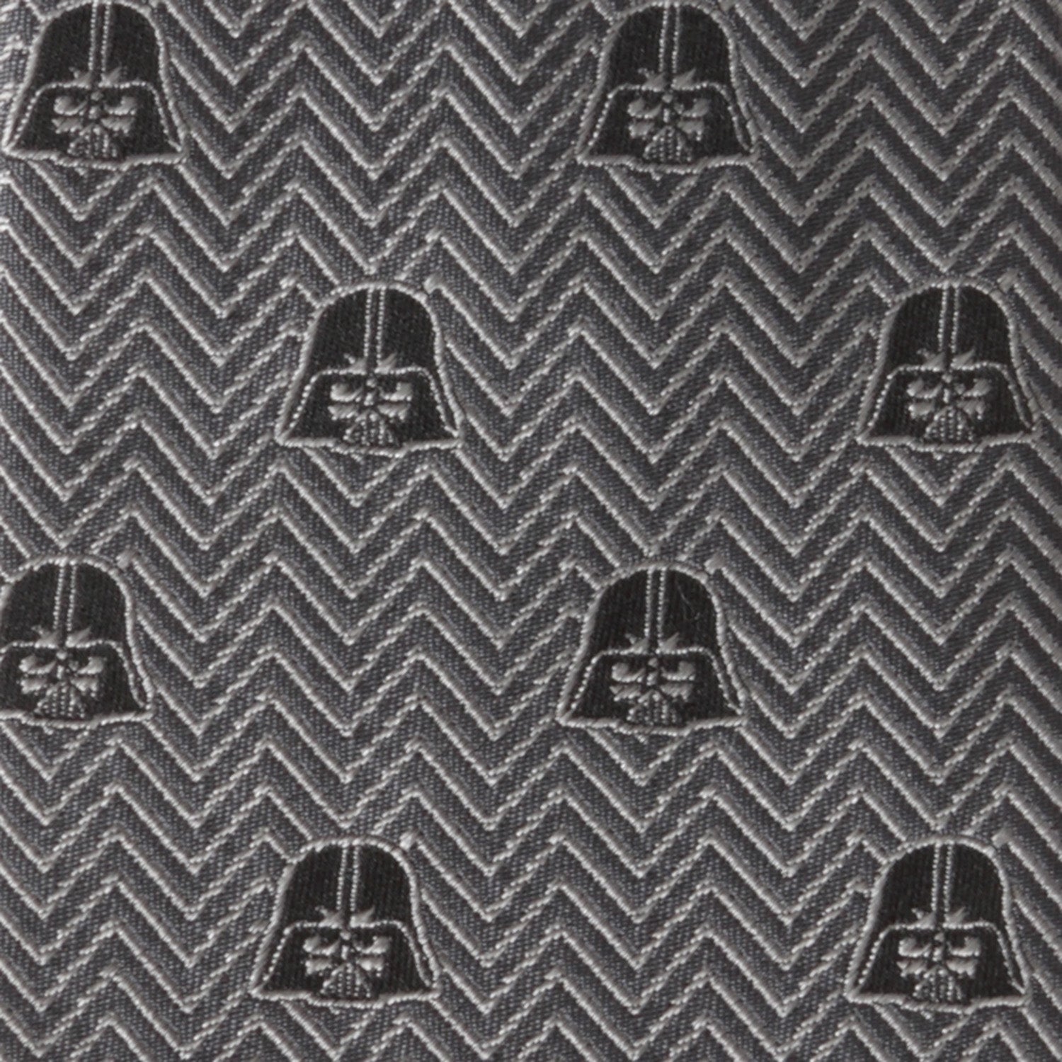 The Cufflinks.com Star Wars Darth Vader Black and Gray Herringbone Tie features a herringbone pattern with repeating Darth Vader helmet motifs.