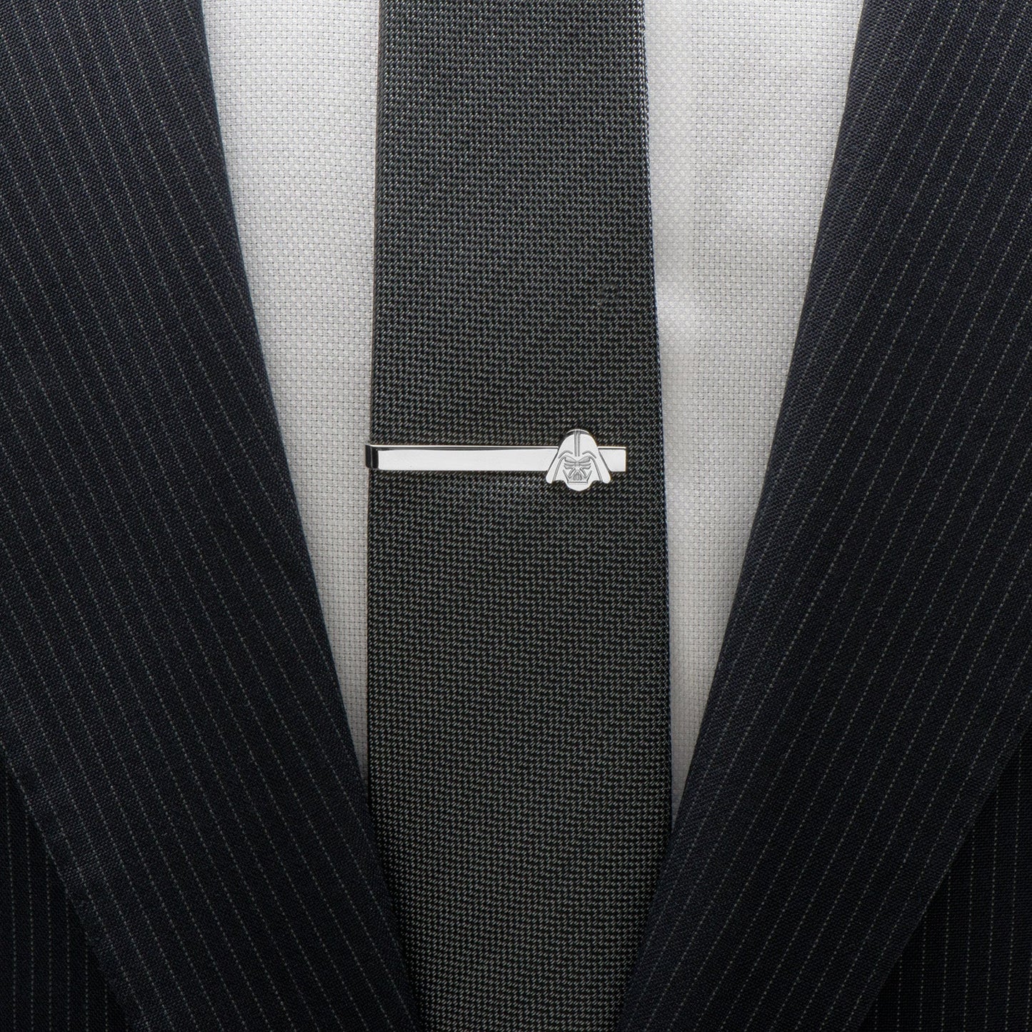 A stainless steel tie bar featuring Darth Vader’s helmet design—an official Star Wars accessory by Cufflinks.com for fans and collectors.