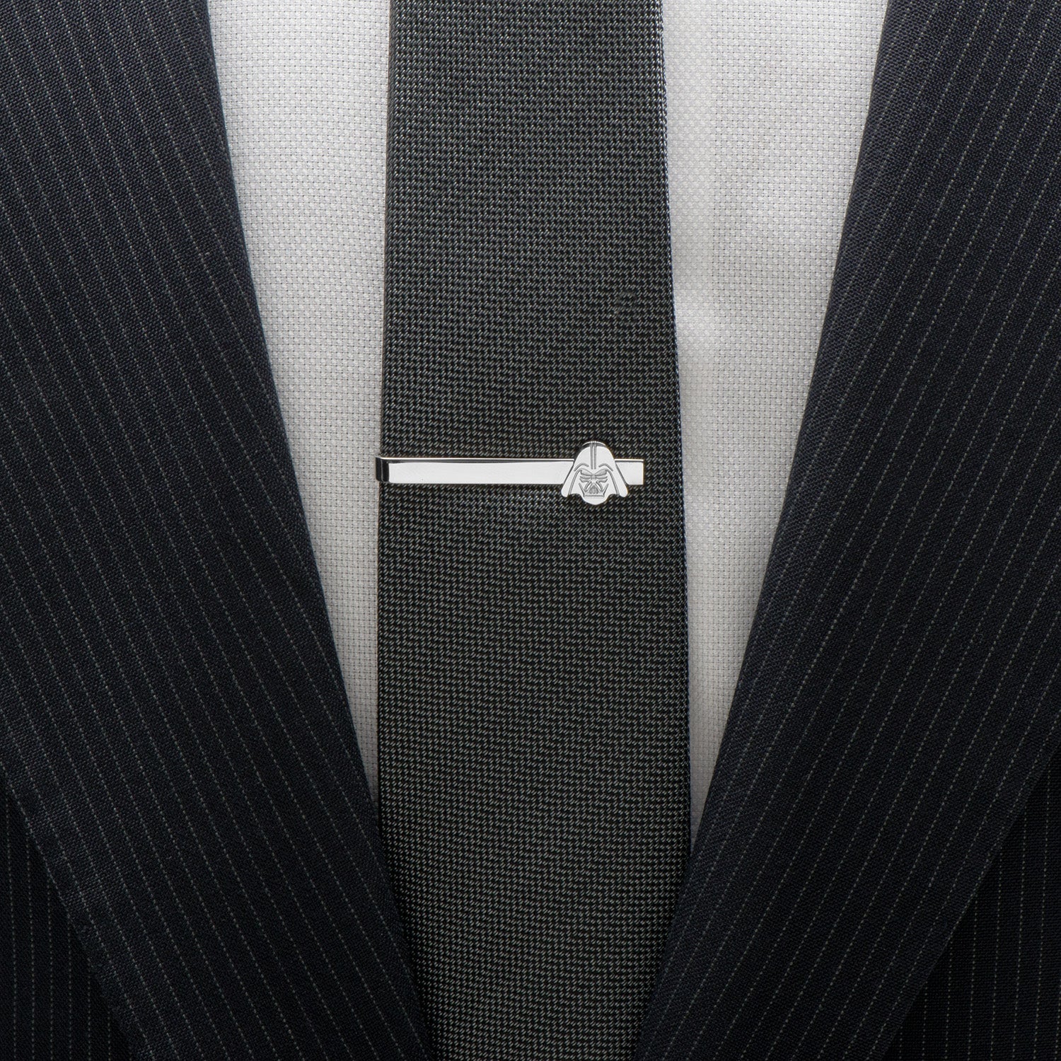 A stainless steel tie bar featuring Darth Vader’s helmet design—an official Star Wars accessory by Cufflinks.com for fans and collectors.