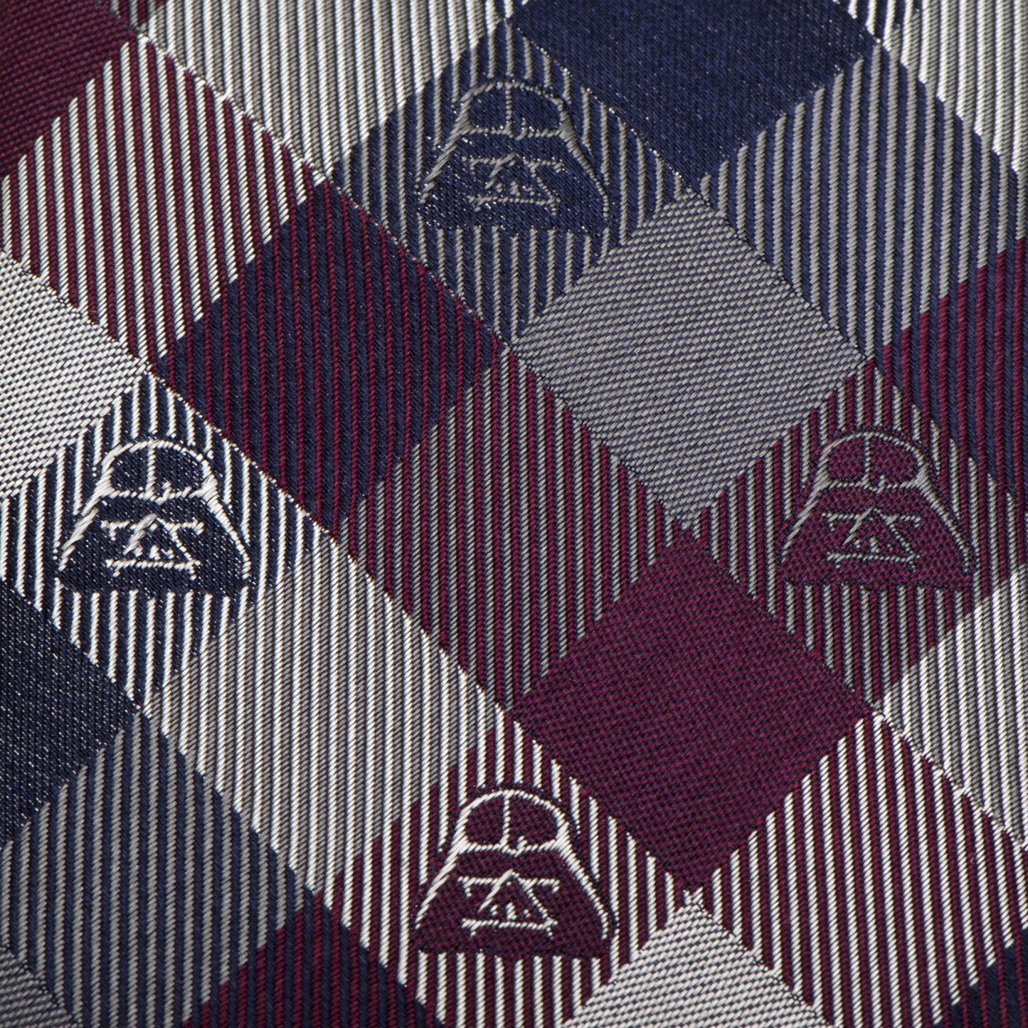 The Cufflinks.com Star Wars Darth Vader Plum Plaid Tie features burgundy, navy, and silver tones with small Darth Vader motifs—an ideal way to add subtle Star Wars style to any outfit.