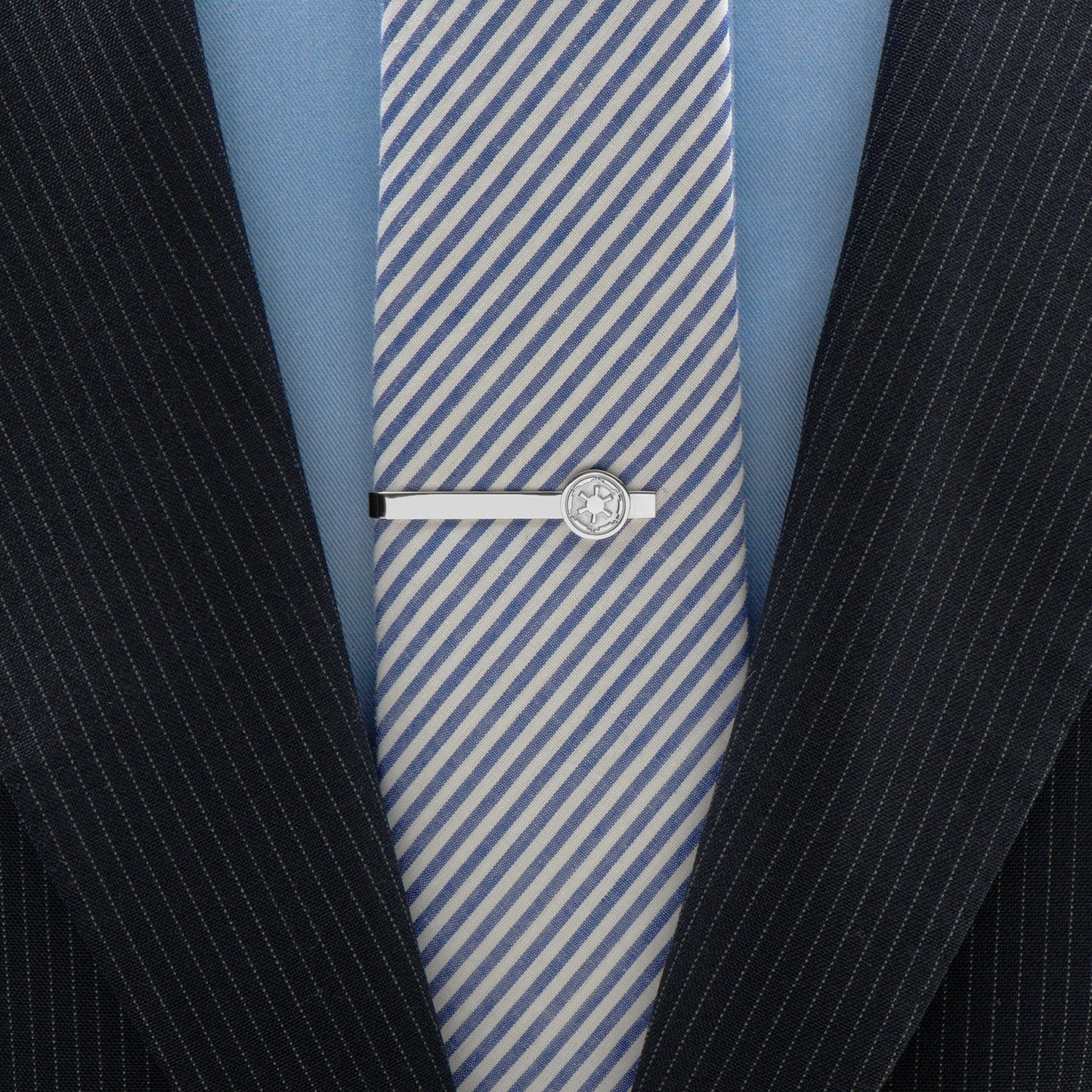 The Star Wars Imperial Crest Stainless Steel Tie Bar by Cufflinks.com features a silver-tone finish and an embossed geometric Imperial emblem, evoking classic Star Wars style against a sleek white background.