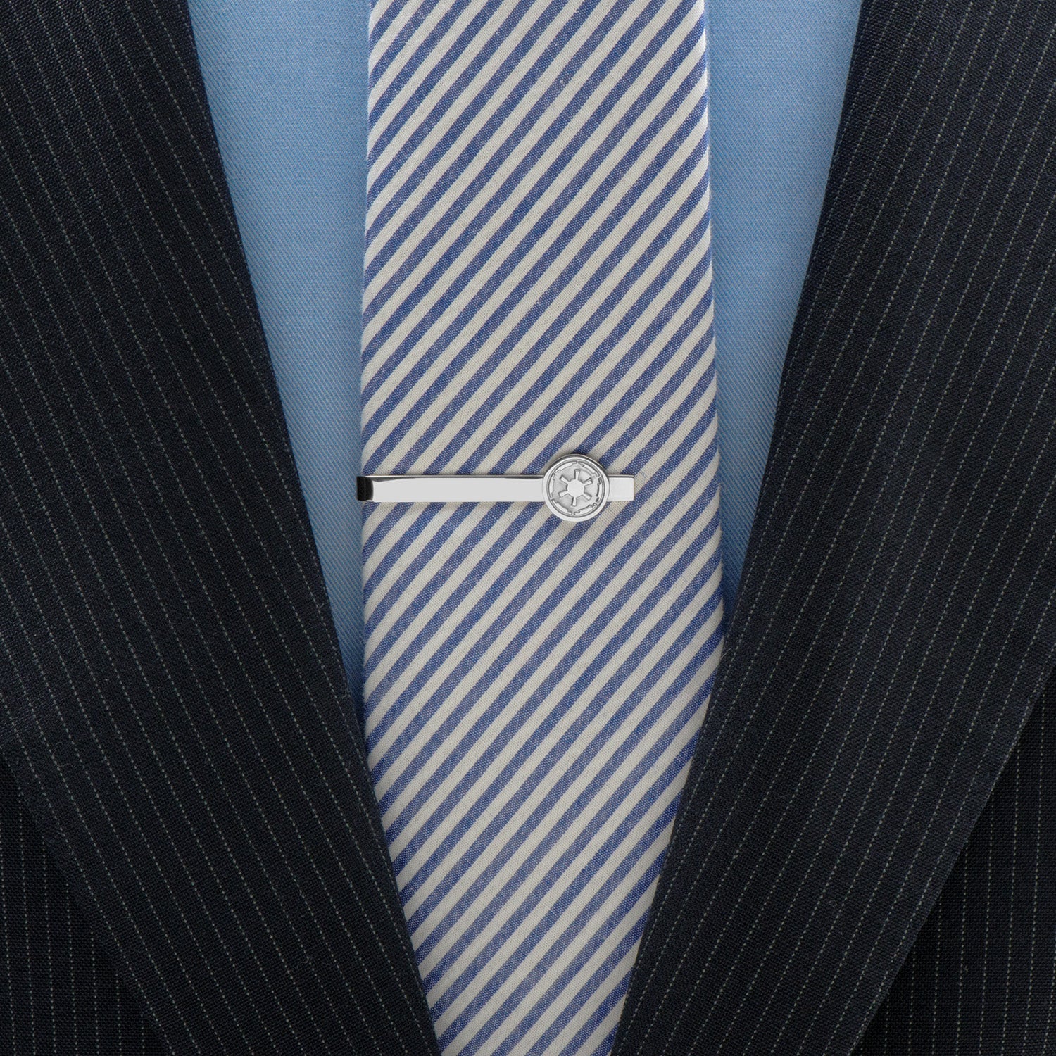 The Star Wars Imperial Crest Stainless Steel Tie Bar by Cufflinks.com features a silver-tone finish and an embossed geometric Imperial emblem, evoking classic Star Wars style against a sleek white background.