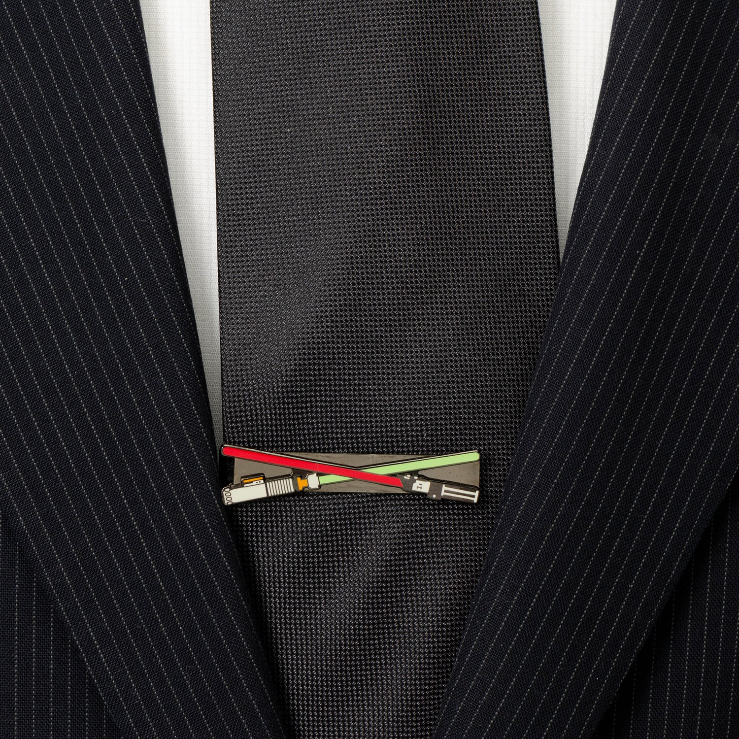 The Cufflinks.com Star Wars Darth Vader and Luke Skywalker LIGHTSABER Battle Tie Bar features crossed red and green lightsabers with black handles—a stylish accessory for any Star Wars fan.