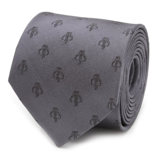 A person wearing a dark pinstripe suit, white shirt, and the Cufflinks.com Star Wars Mandalorian Mythosaur Gray Silk Tie with a silver tie bar, shown from shoulders to mid-chest.