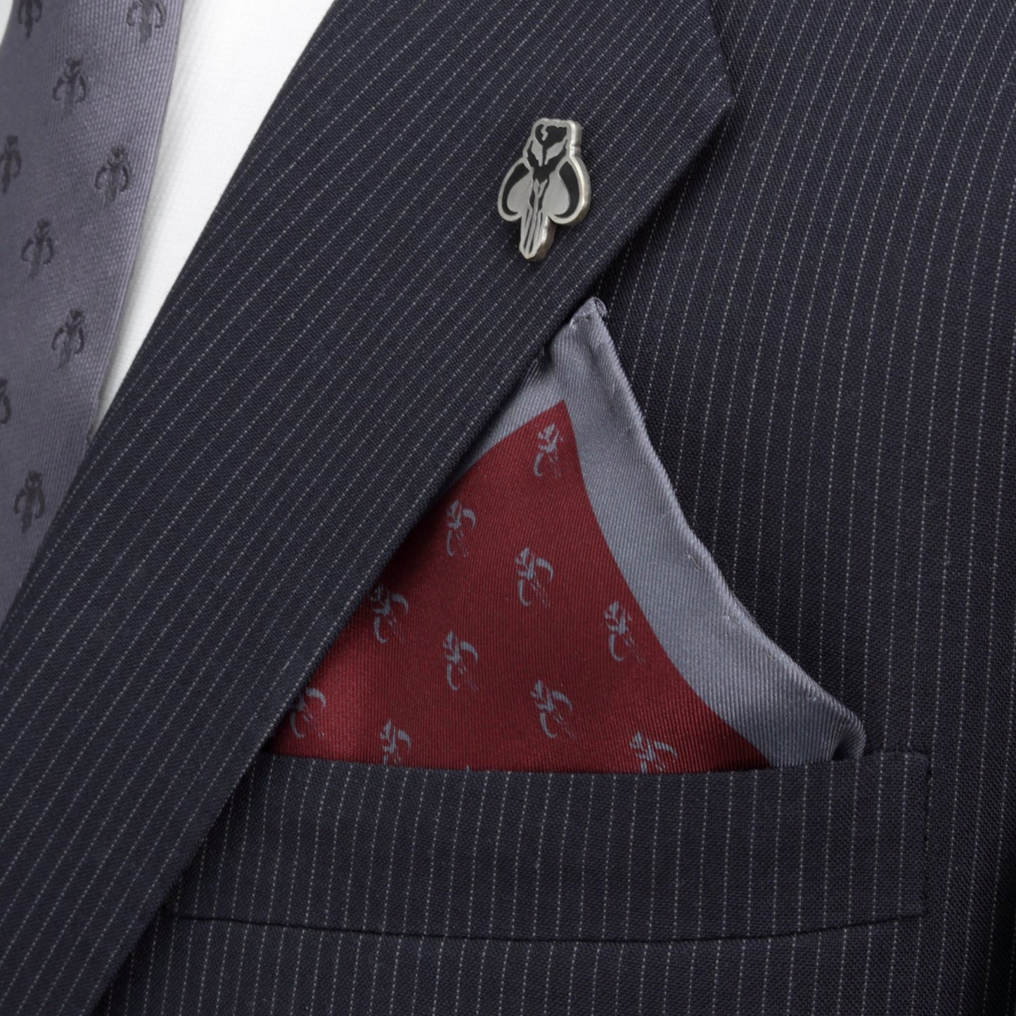 The Star Wars Mandalorian Red Silk Pocket Square by Cufflinks.com features a subtle repeating blue crab design and a solid blue border—an elegant accessory to add refined Star Wars style to your outfit.
