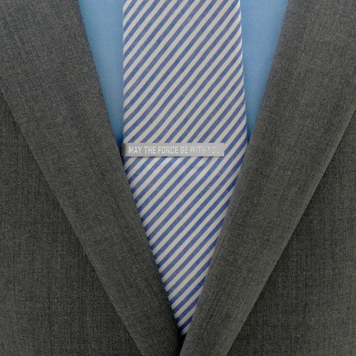 The Star Wars May The Force Be With You Tie Bar by Cufflinks.com features a polished silver finish and is engraved with "MAY THE FORCE BE WITH YOU" in bold capital letters.