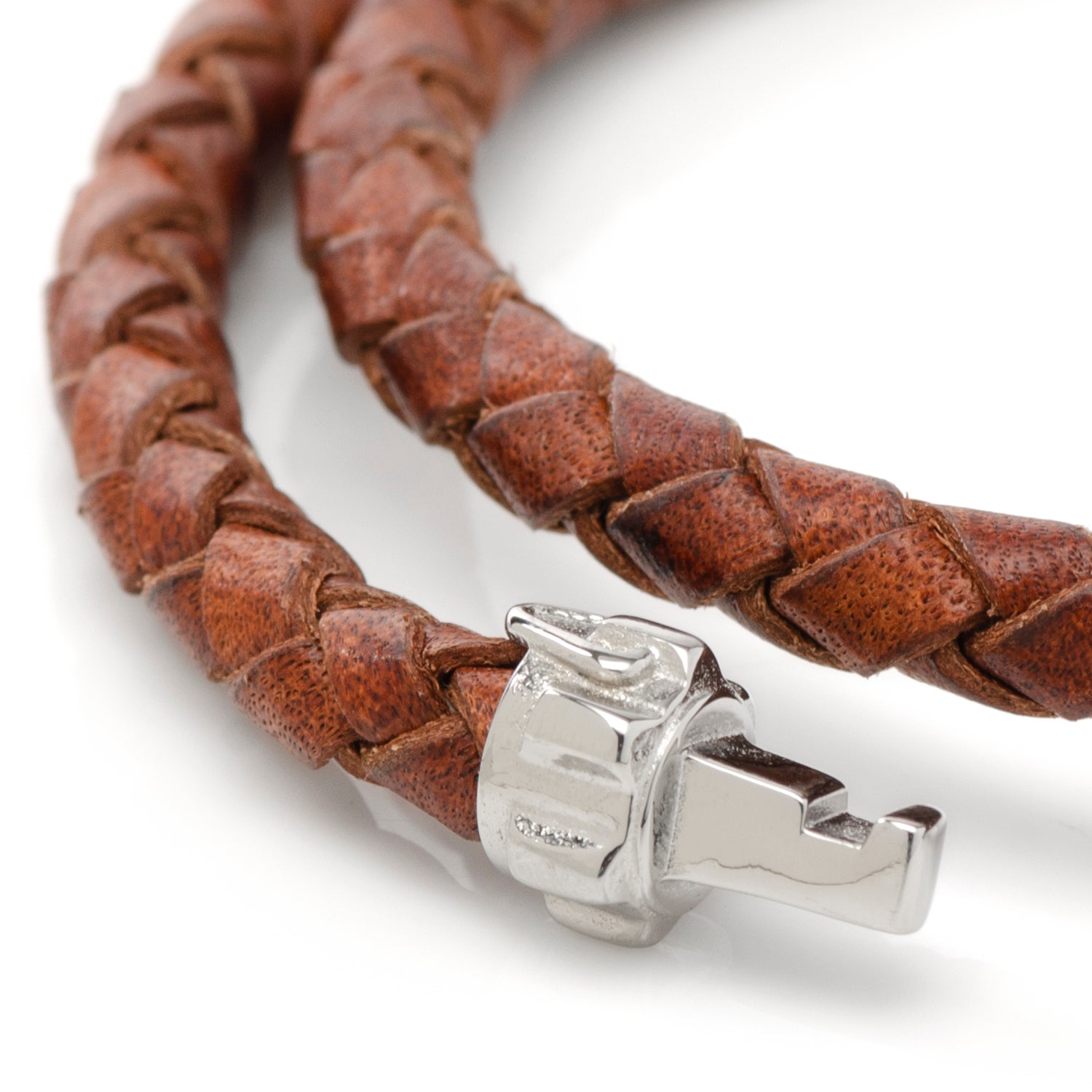 The Star Wars Obi-Wan Kenobi LIGHTSABER Bracelet by Cufflinks.com features brown braided leather and a lightsaber hilt clasp—a distinctive accessory for any Star Wars fan.